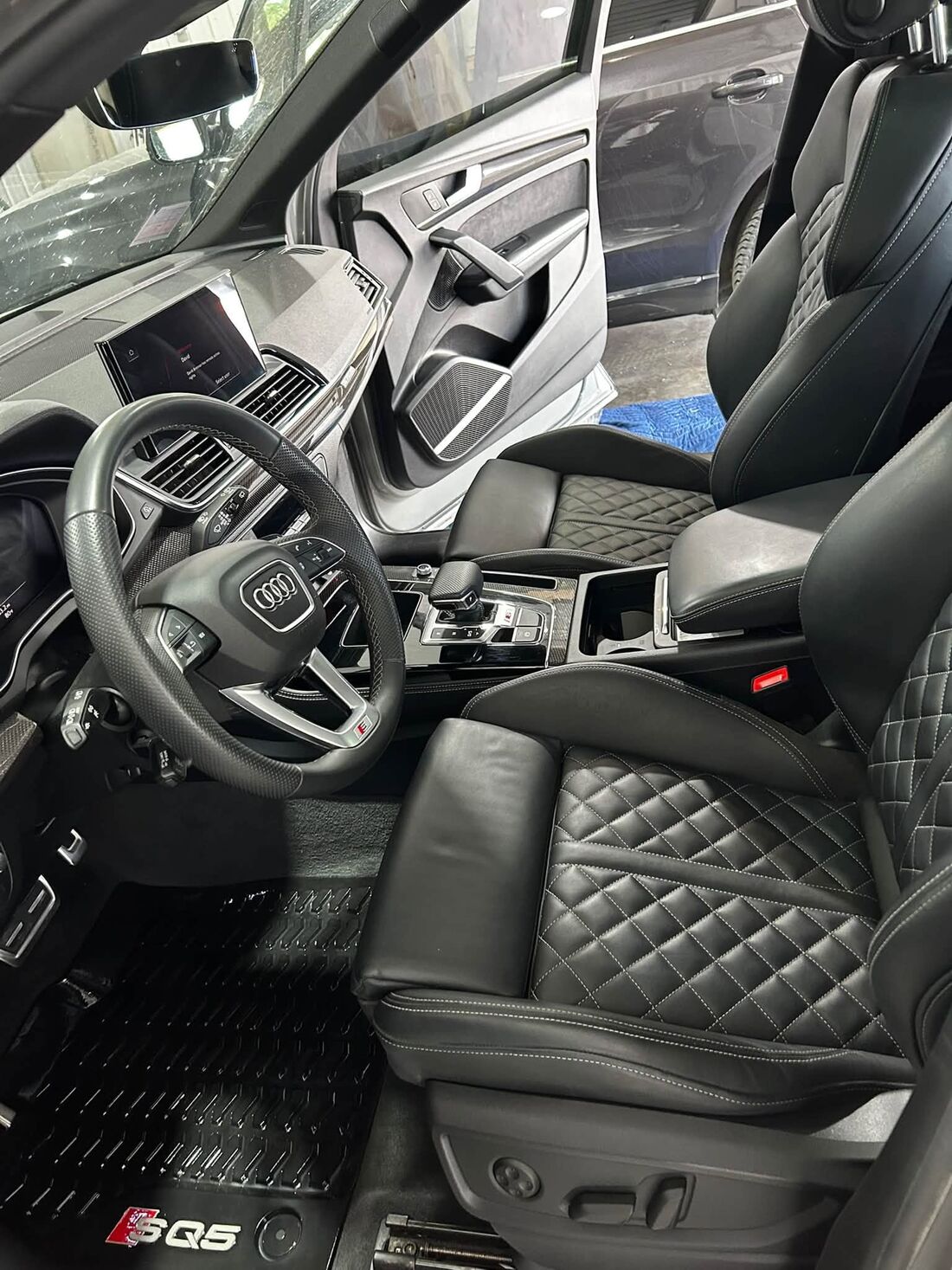 Audi SQ5 front seats, dash and floor mats after an interior detail