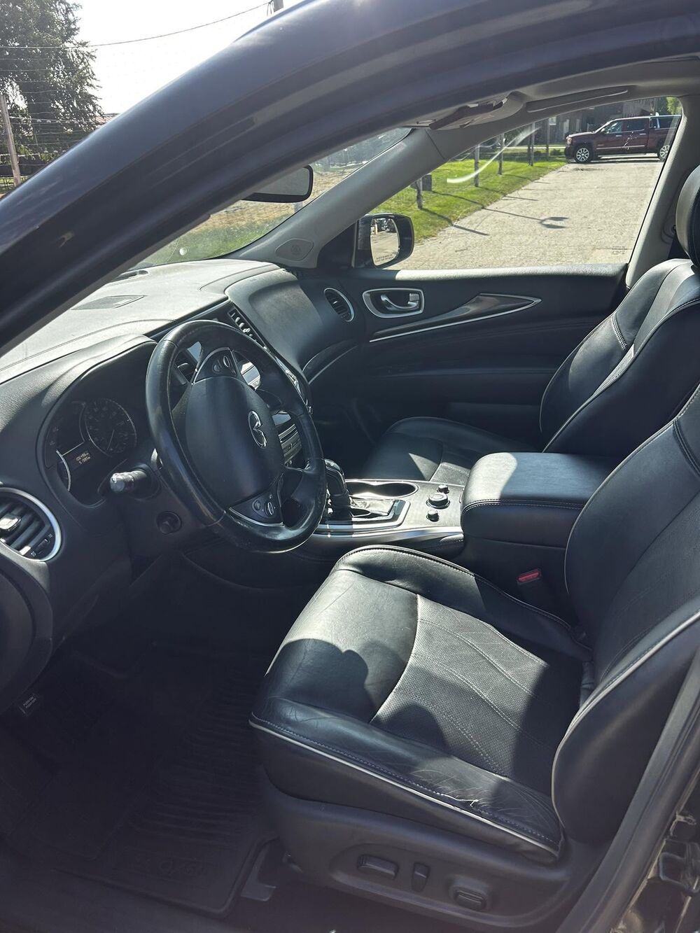 Clean leather front seats and dash of an SUV